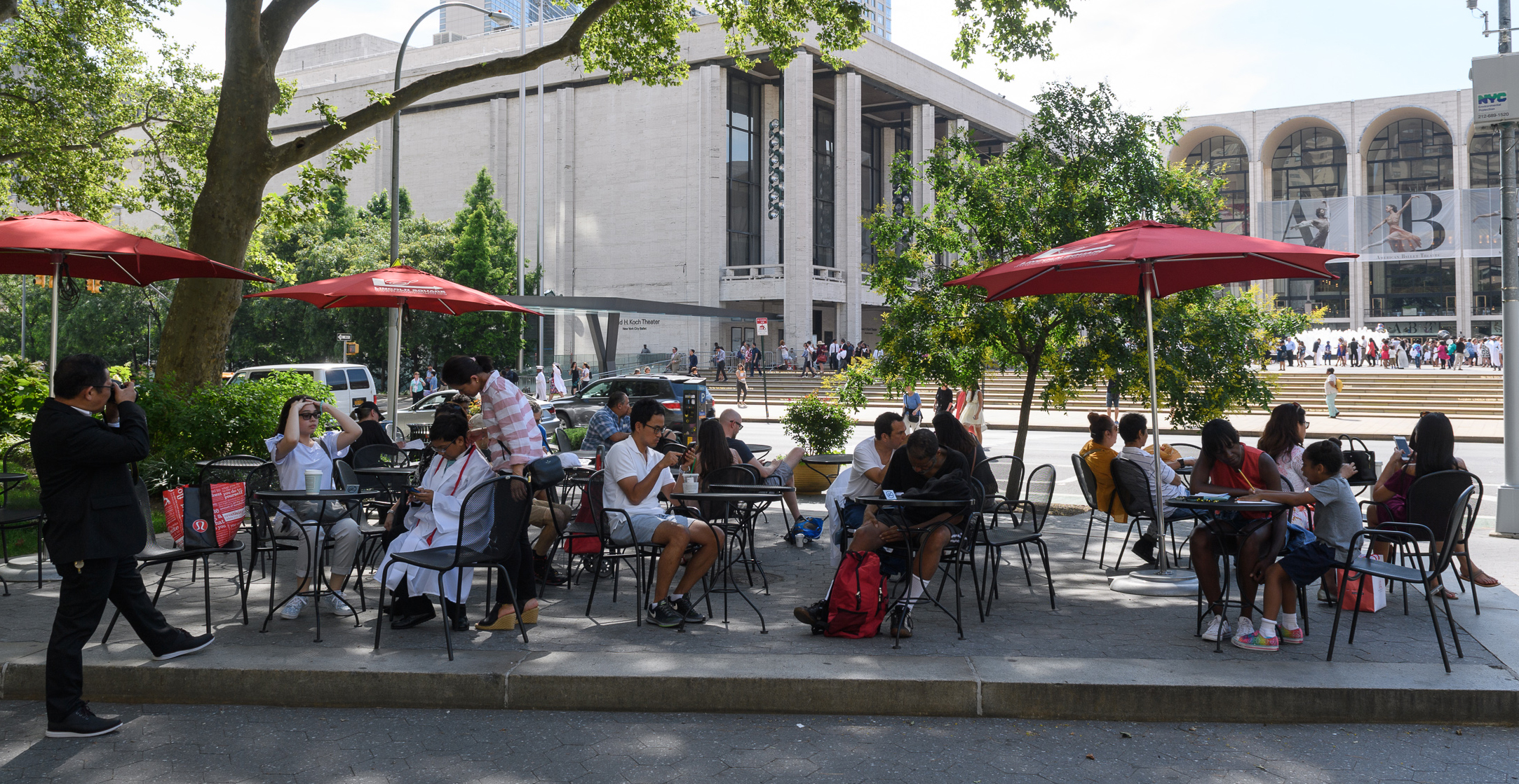 patrons sit and enjoy Dante Park's raised seating area