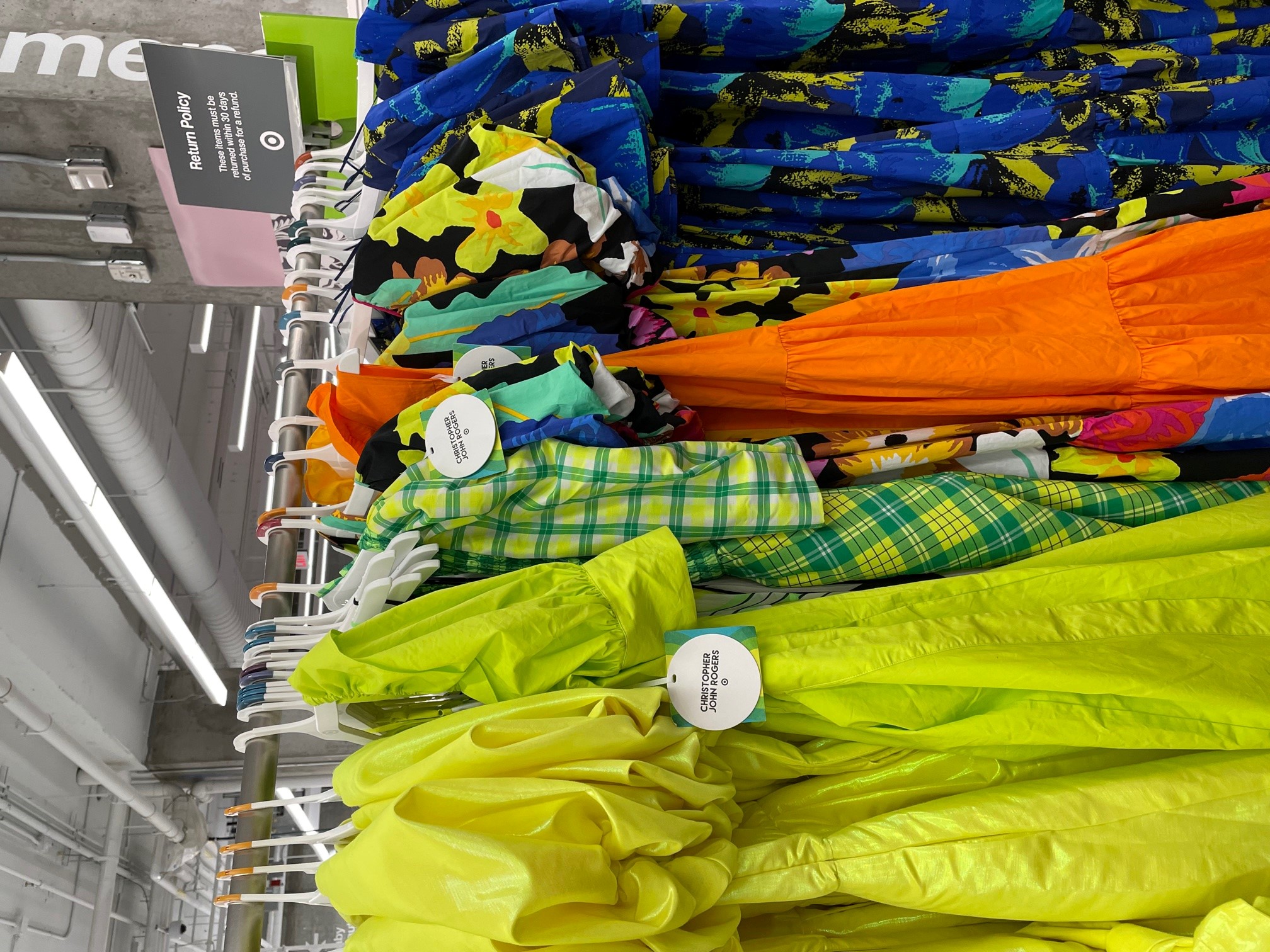 a rack of the designer dress collection dresses available at the UWS Target location