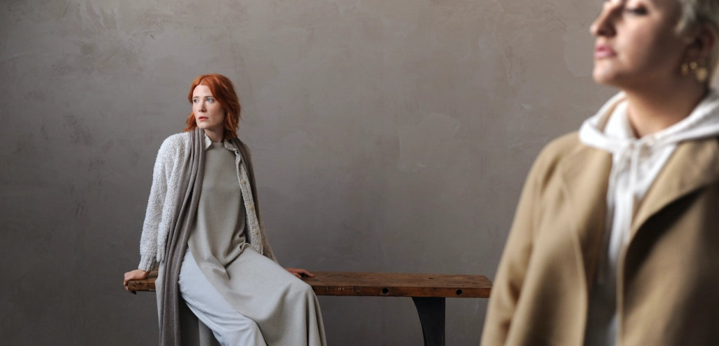 two women pose in clothes from Eileen Fisher's spring 2021 collection in a grey set