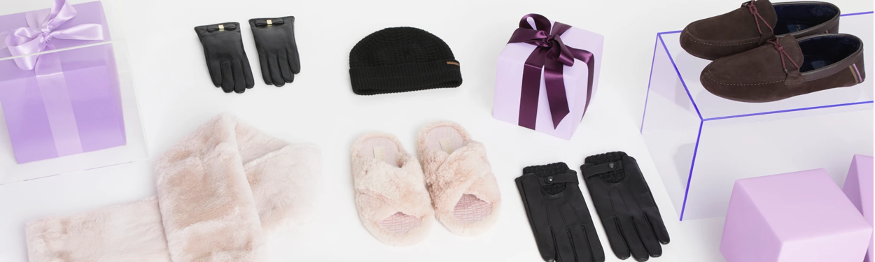 slippers and gloves from Ted Baker laid out with presents