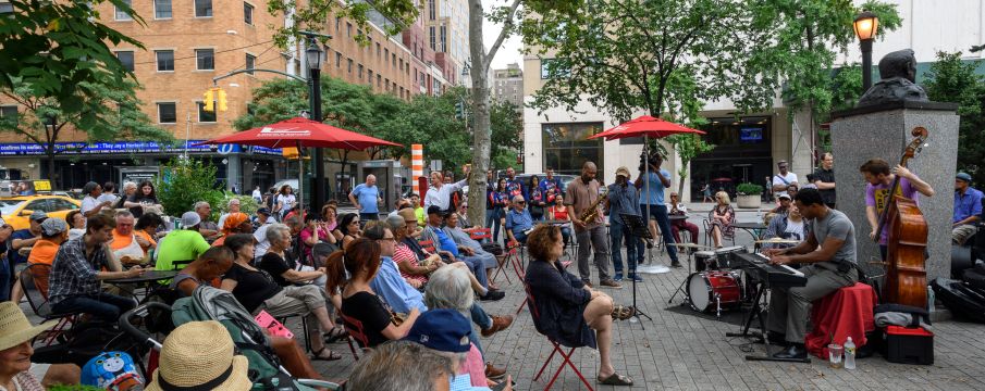 parkgoers enjoy free music in Richard Tucker Park in the summer