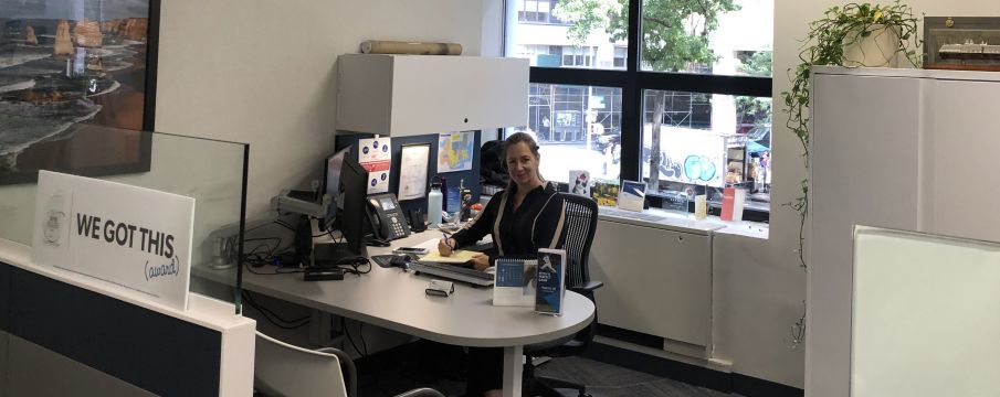 Manhattan Agent Joan sits at her desk in the AAA office at 1881 Broadway