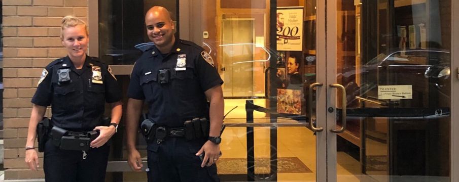 Neighborhood Coordination Officers Fanning and Vasquez pose in uniform