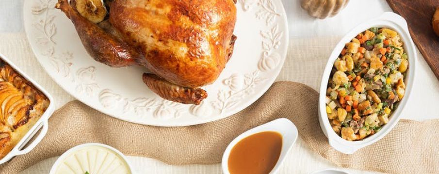 table set with turkey, stuffing, and gravy from Epicerie Boulud