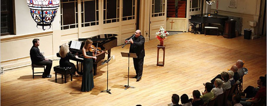 players perform before an audience at the church of st paul 