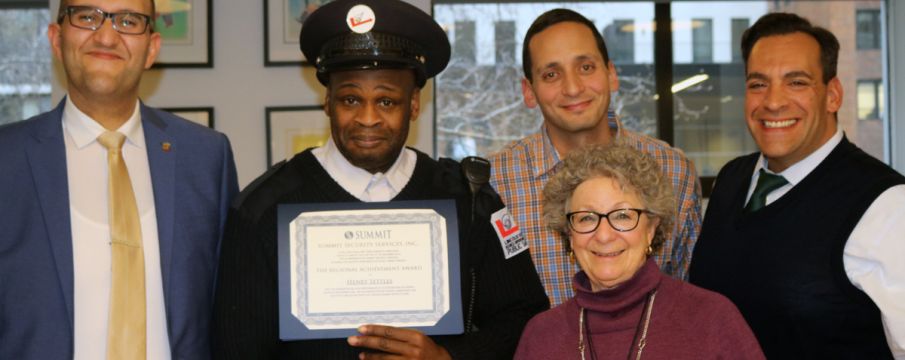 LSBID President_ Monica Blum_ Director of Operations Phil Gordon_ Executive Vice President Ralph Memoli_ Public Safety Supervisor Henry Settles_ and a representative from Summit Security pose for a photo