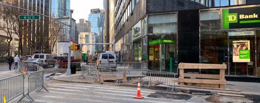 photo looking down the Bway sidewalk from west 62nd street with many barricades and additional construction