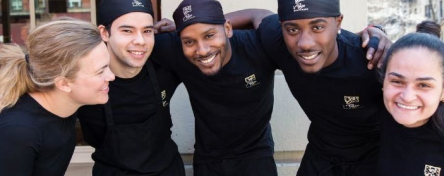 staff from Le Pain Quotidien pose for a photo together in uniform