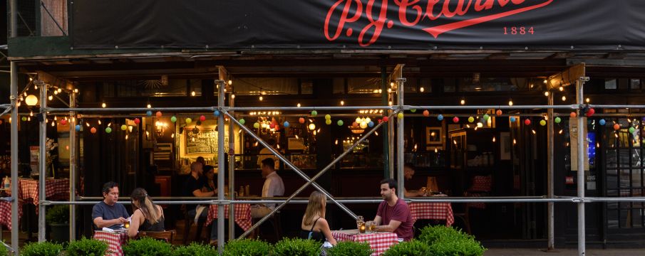 people dining outside pj clarke's