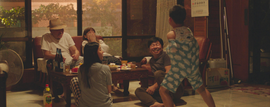 screencap of a family from "Moving On"