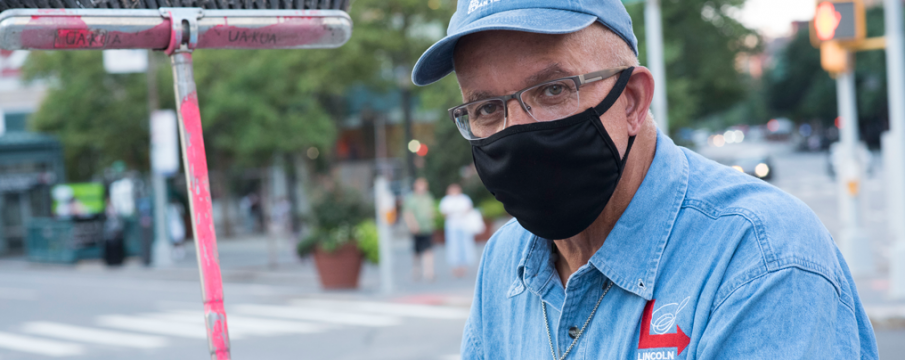 Close up of clean Team Member Carl wearing a black face mask