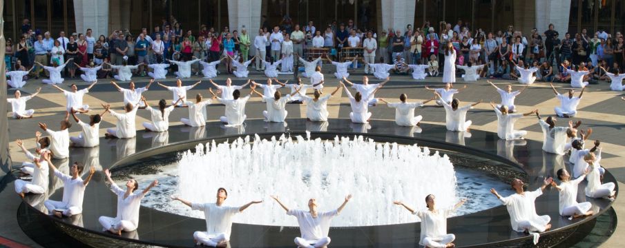 dancers sitting in a circle on lincoln center plaza