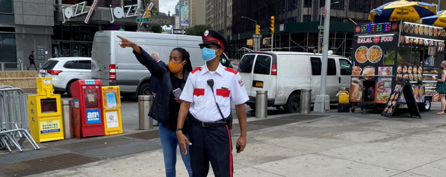 public safety officer helping a pedestrian with directions