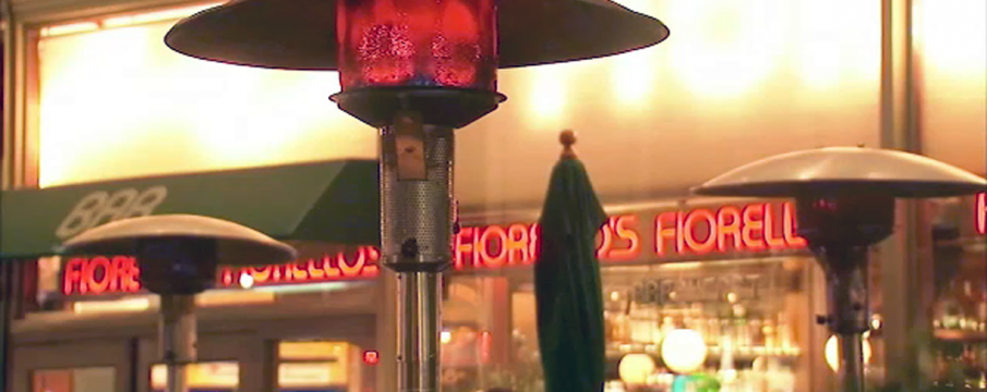 A close up of heaters at Cafe Fiorello's outside sidewalk seating