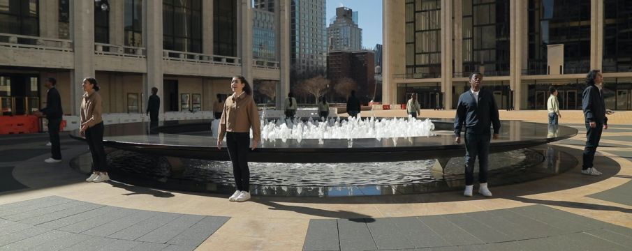 young people's chorus performing around the lincoln center fountain