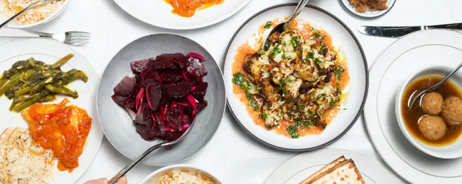 a table of foods from Breads Bakery's Passover Seder Meal for order 