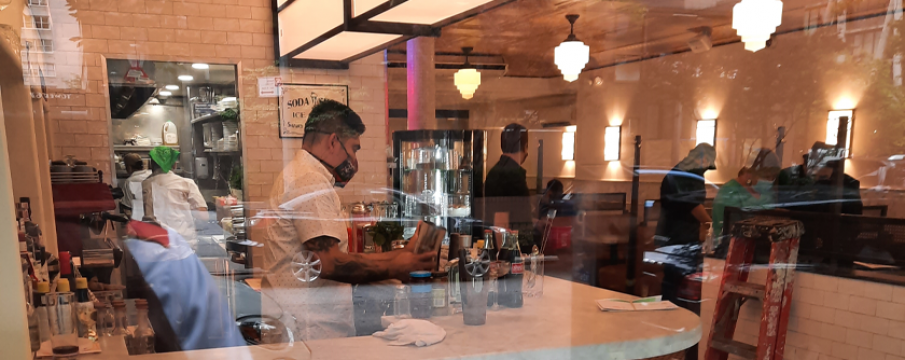 people working on the interior of old john's diner