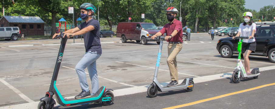 people riding e-scooters