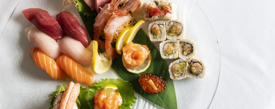 various sushi rolls and pieces of sashimi arranged on a plate from Atlantic Grill