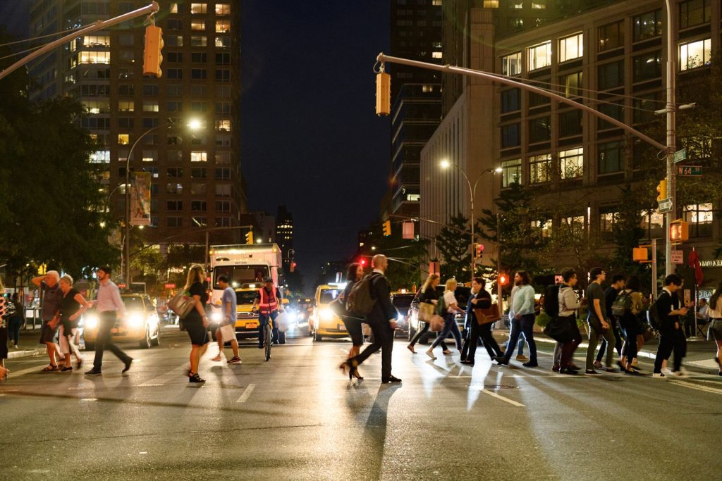 crowds moving through a crosswalk in Lincoln Square at 64th Street